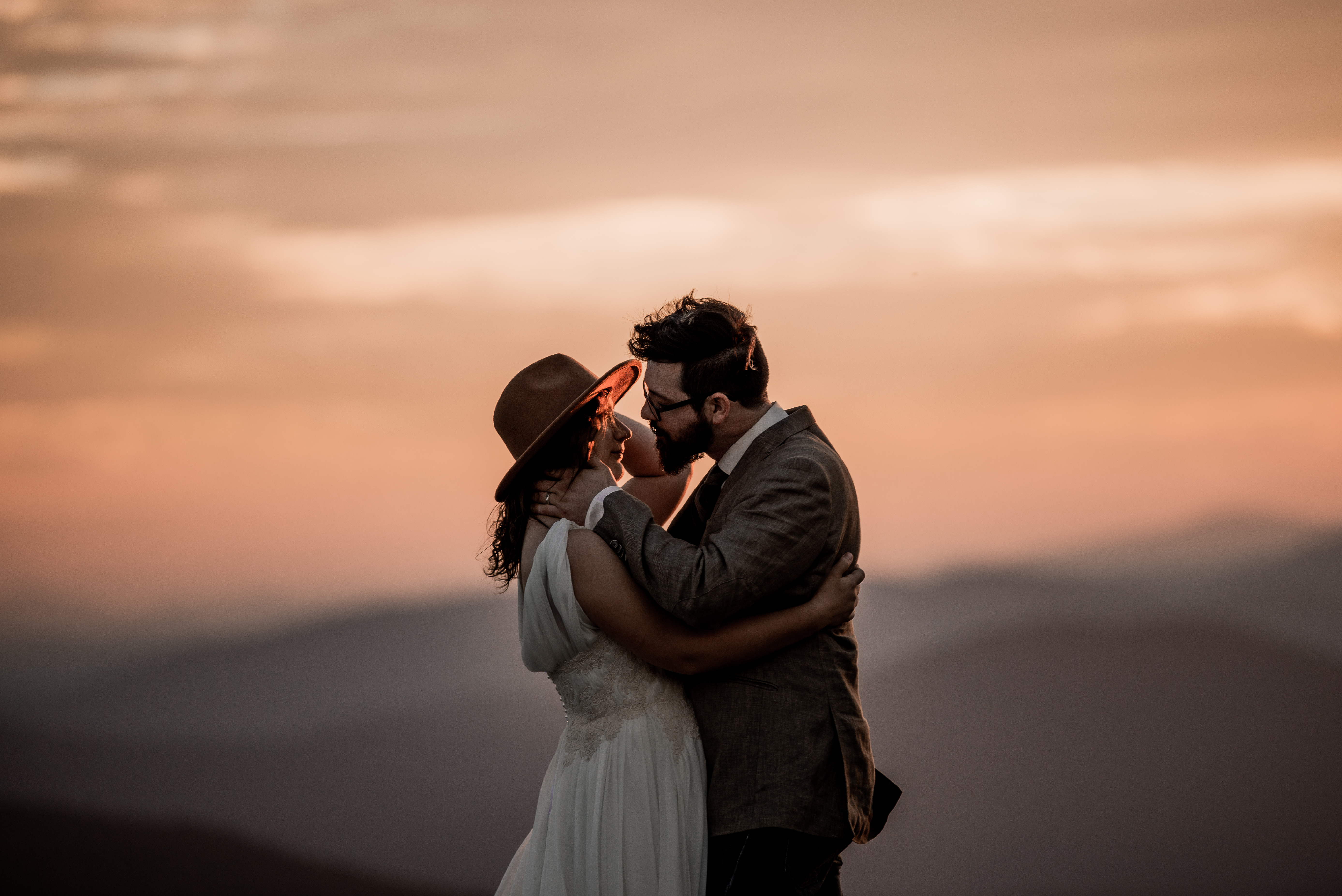Adventurous elopement photo on a mountain