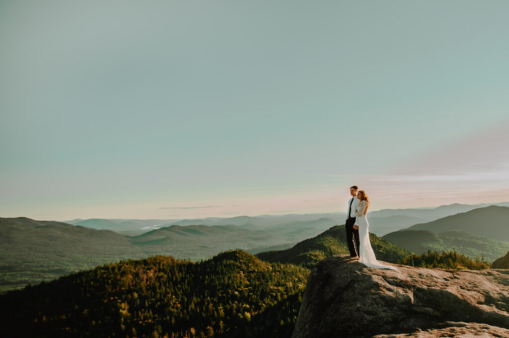 Bride and groom eloping in mountains, without their family at the elopement 