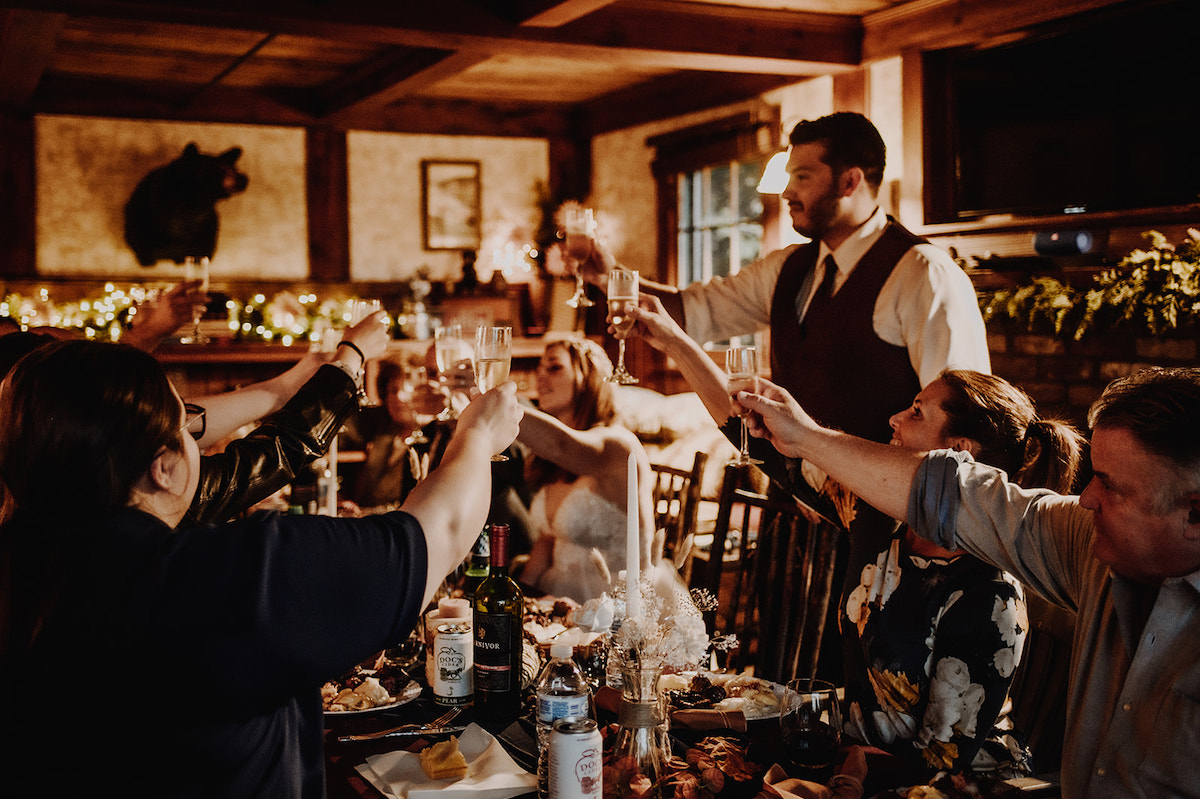 Bride and groom toast to their elopement champagne 