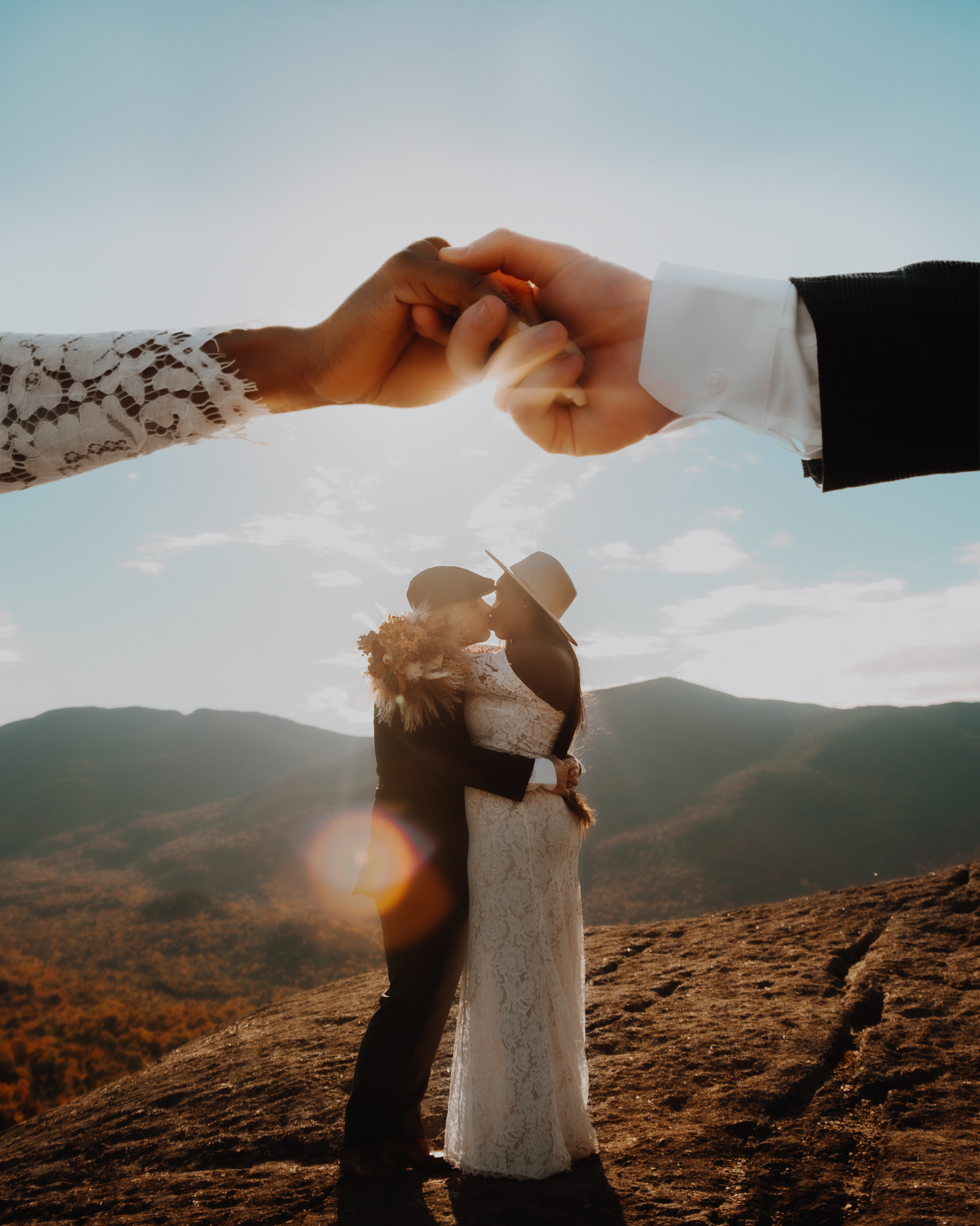 Double exposure wedding photo made in photoshop with hands over the couple's head