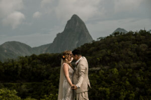 Bride and groom holding hands and touching foreheads during destination wedding in St Lucia, an island in the Caribbean