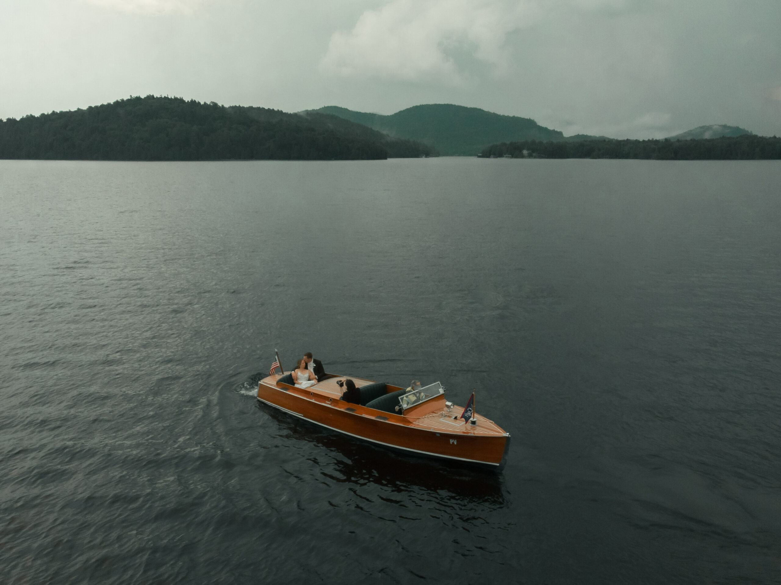 Bride and grrom on a boat at the Whiteface Club and Resort