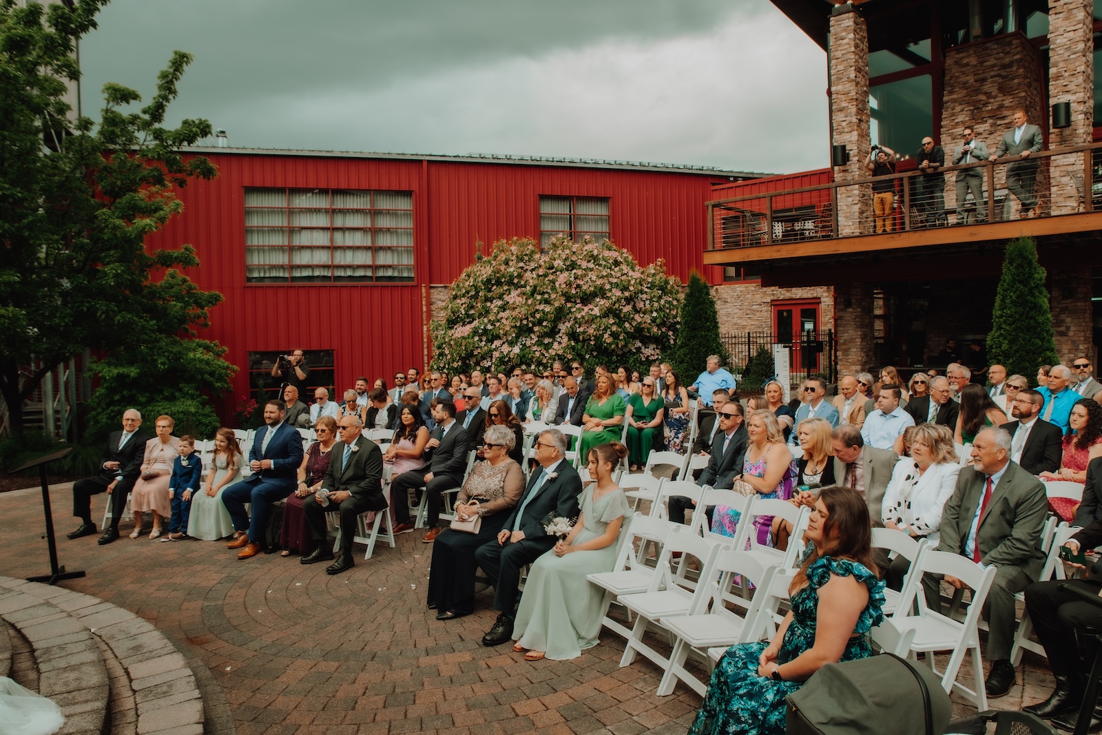 Guests sitting down watching wedding ceremony during a cloudy day at Bear Creek Mountain Resort in Macungie, PA