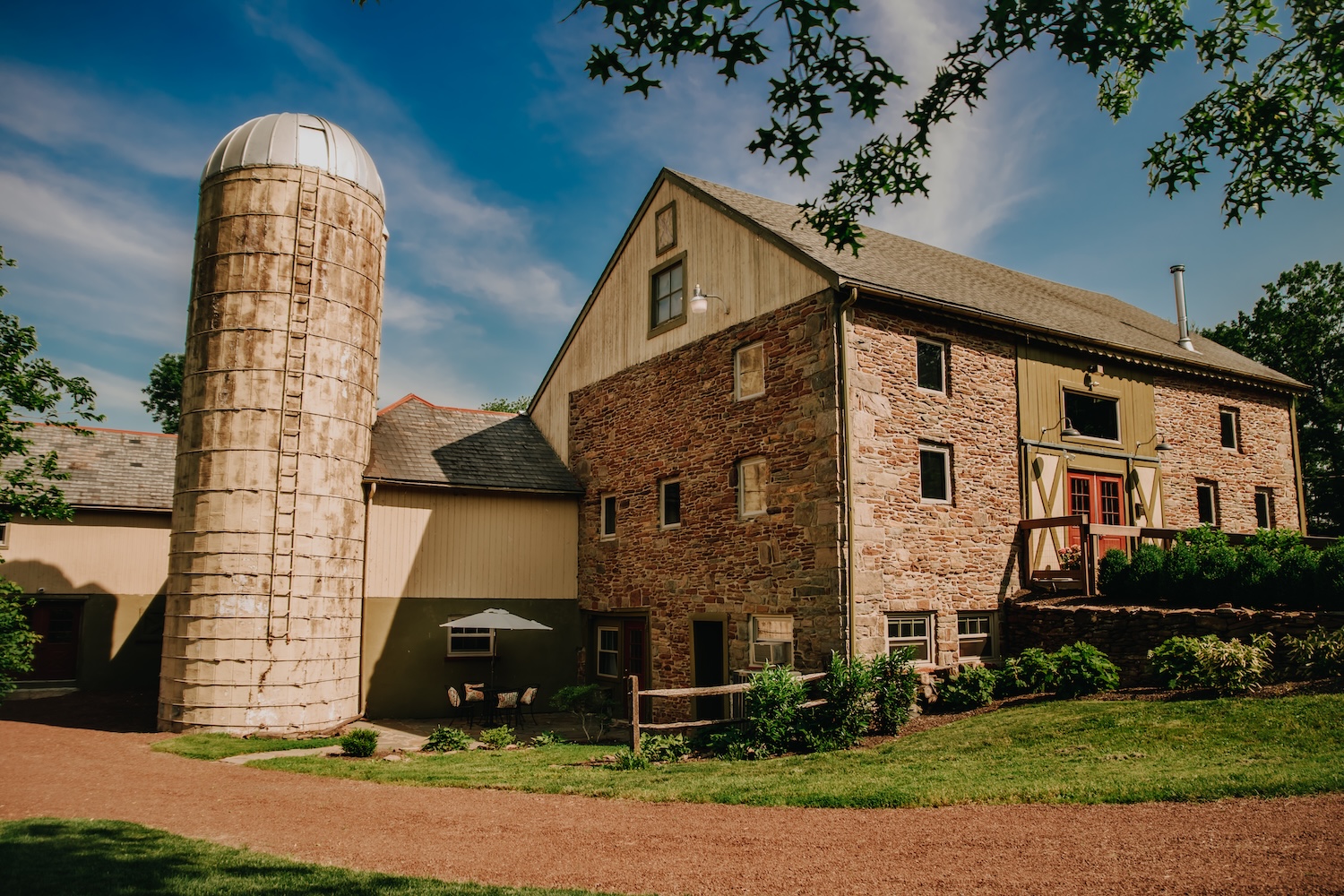 Stone Ridge Farm Inn's historic siloh and barn building, recently converted into a stunning modern wedding venue with a chic rustic style