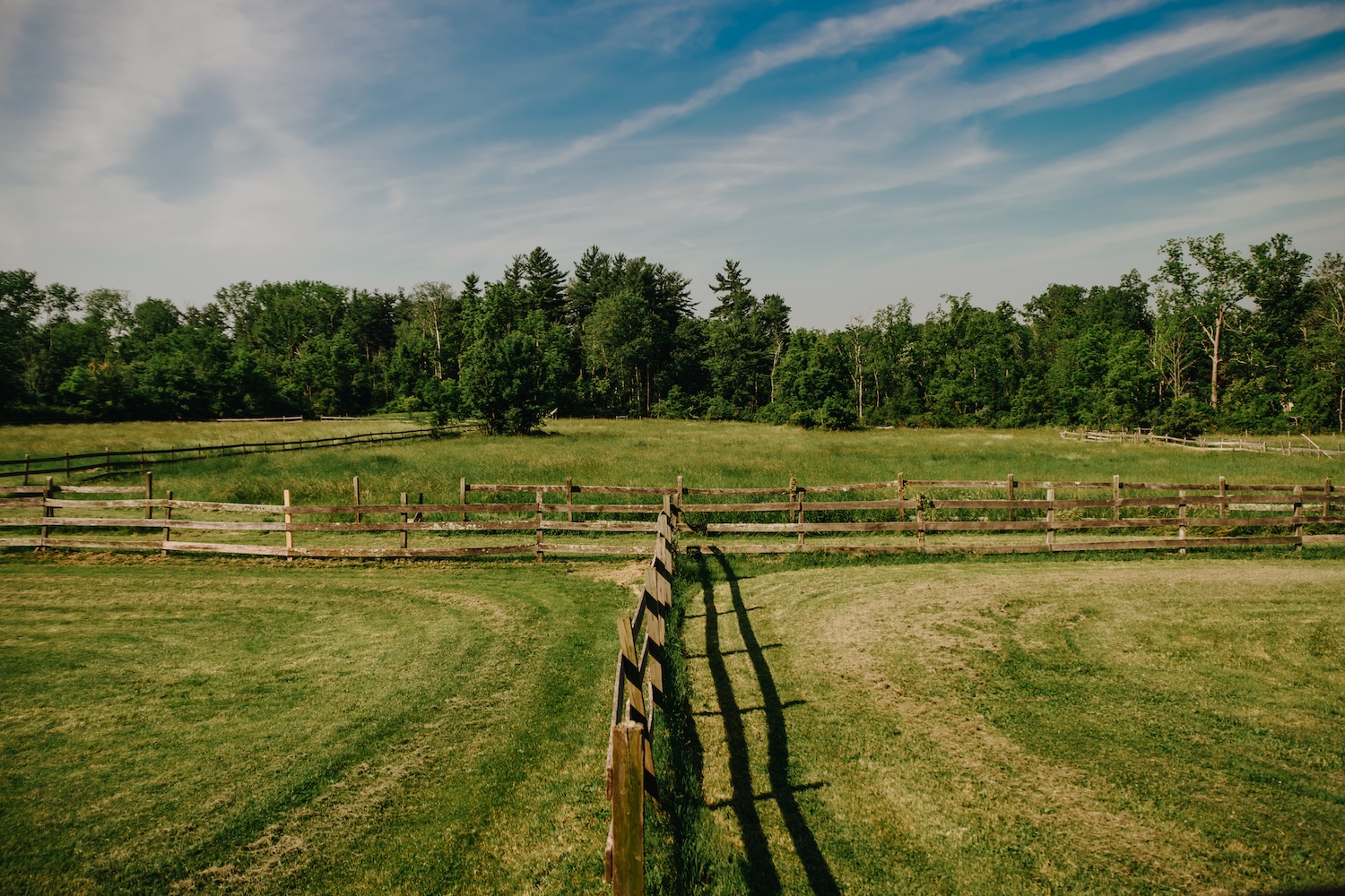 Green pastures on a partly cloudy day at Stone Ridge Farm Inn, a micro wedding venue in Bucks County, PA